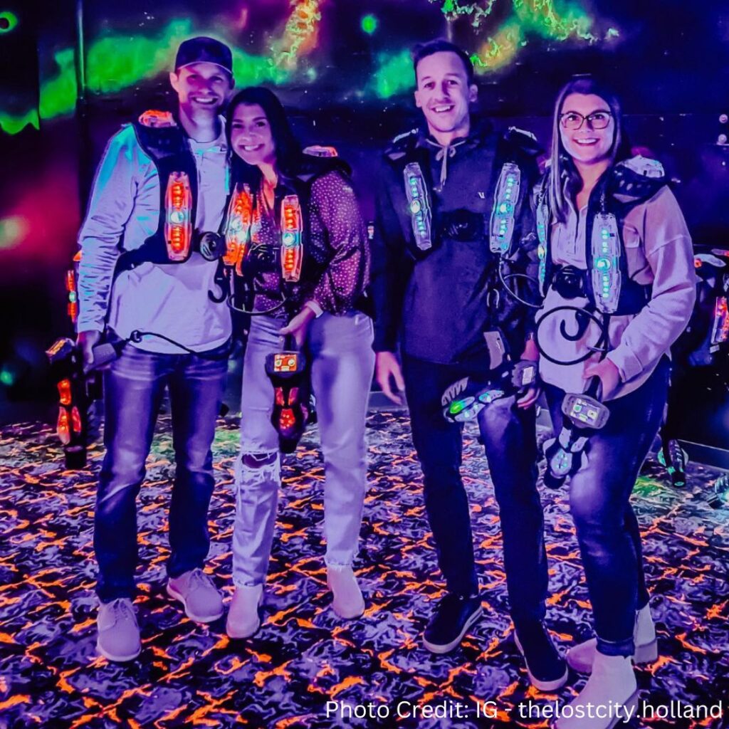 Group of young adults in LaserBlast CyberBlast Pro laser tag gear at The Lost City in Holland, Michigan.