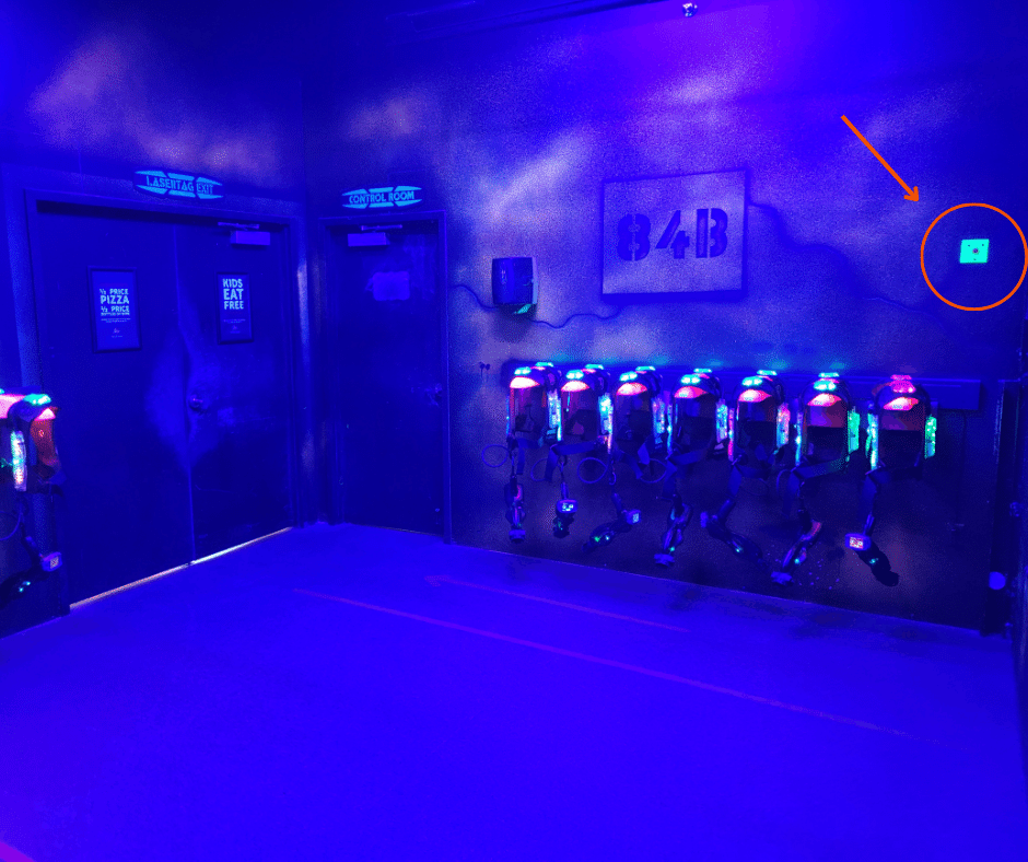 Start button pictured inside of a laser tag vesting room