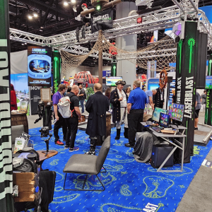 LaserBlast Trade Show Booth full of people and staff at IAAPA 2025
