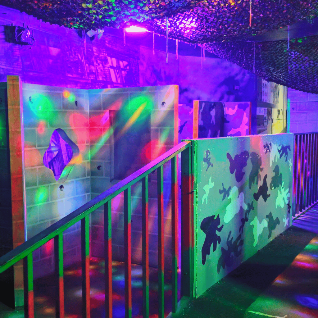 Inside a multicolor laser tag arena.