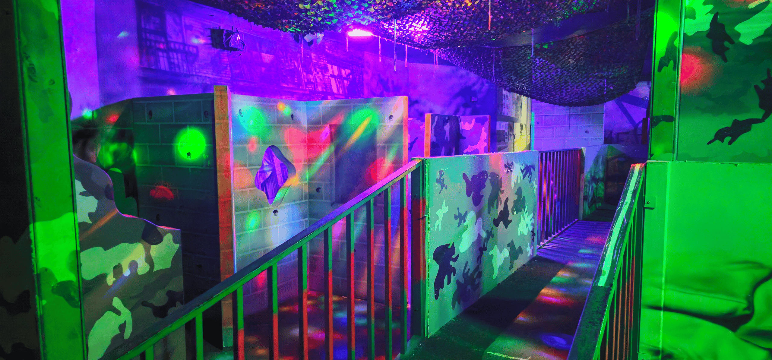 Inside a multicolor laser tag arena.
